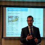LinguaBridge UK business English training—professional giving a presentation